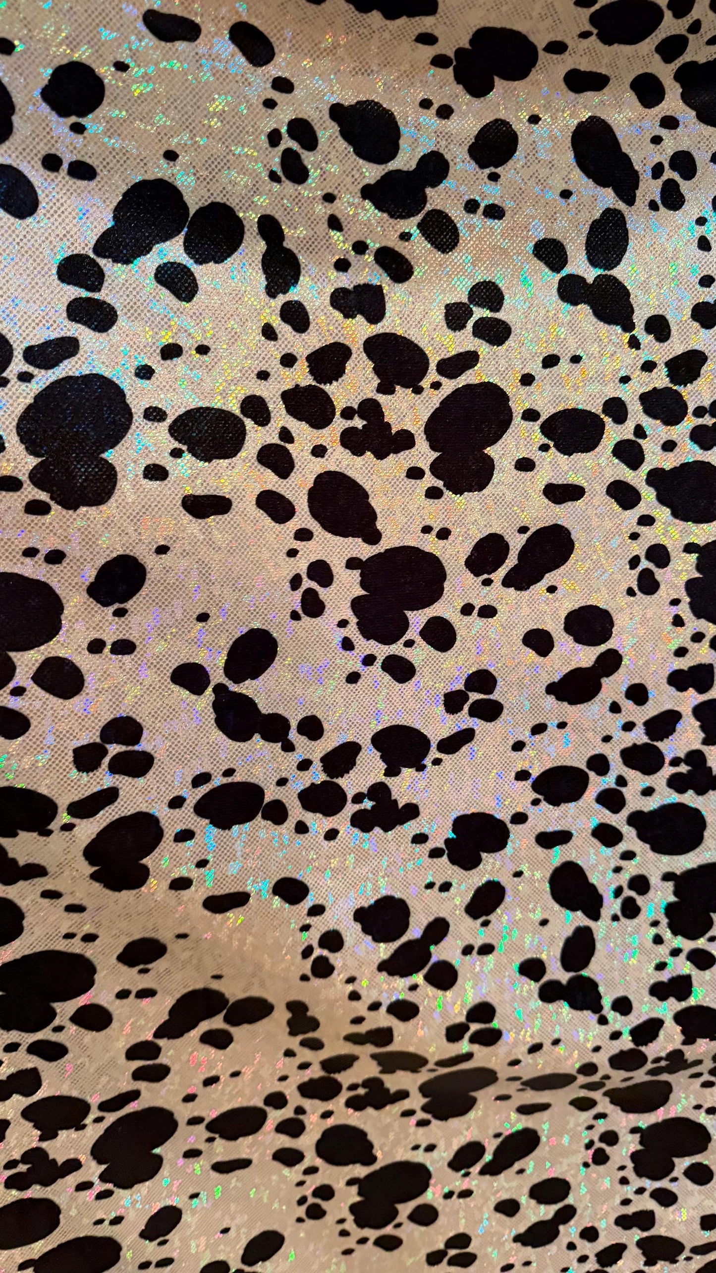 Dalmatian Exotic design w/silver/Black on shattered glass hologram metallic nylon spandex 4-way stretch 58/60” Sold by the YD. High quality