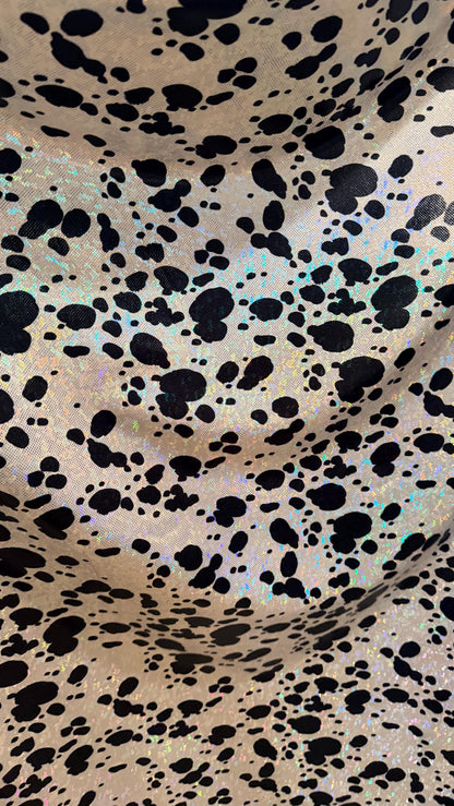 Dalmatian Exotic design w/silver/Black on shattered glass hologram metallic nylon spandex 4-way stretch 58/60” Sold by the YD. High quality