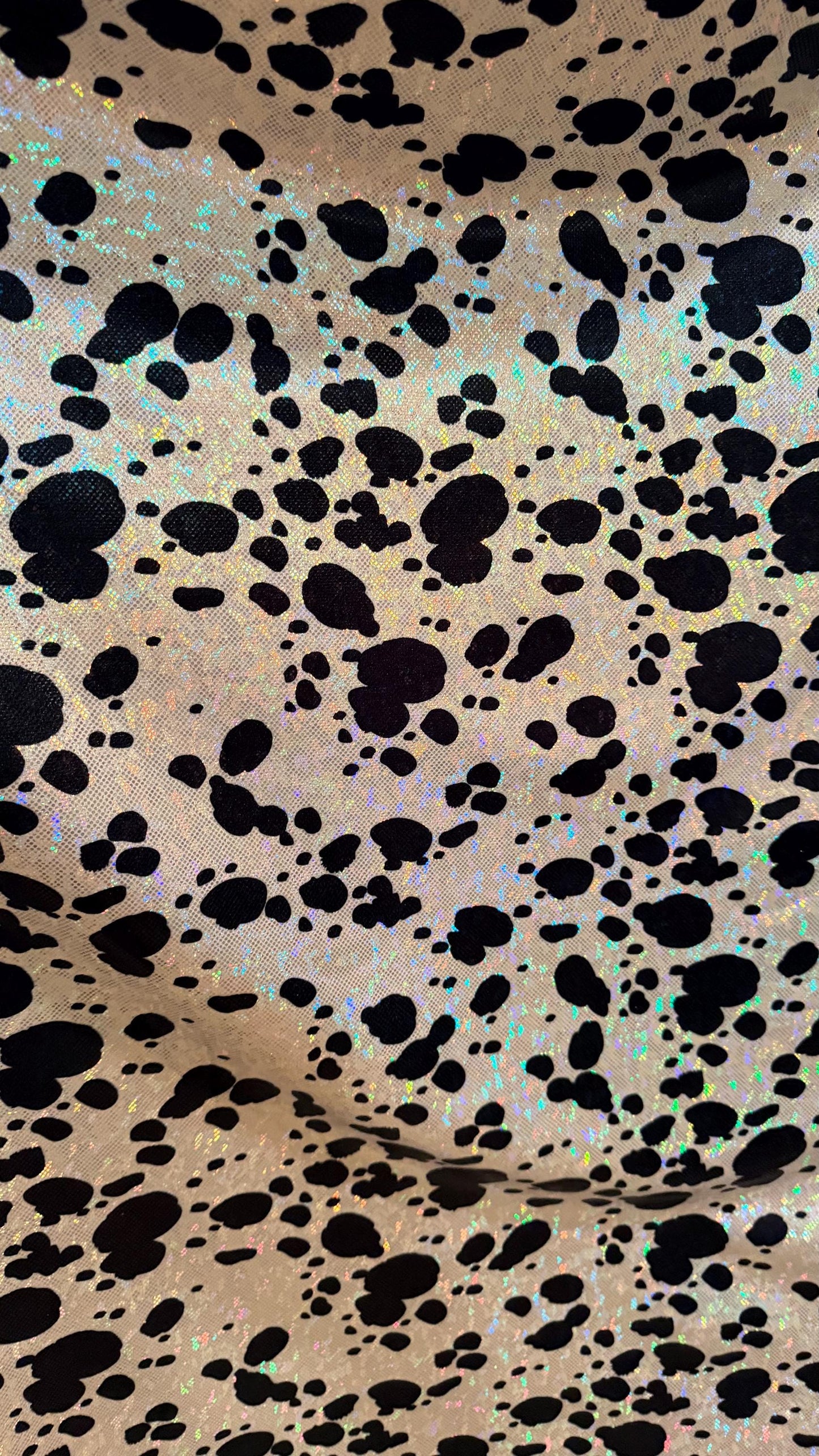 Dalmatian Exotic design w/silver/Black on shattered glass hologram metallic nylon spandex 4-way stretch 58/60” Sold by the YD. High quality