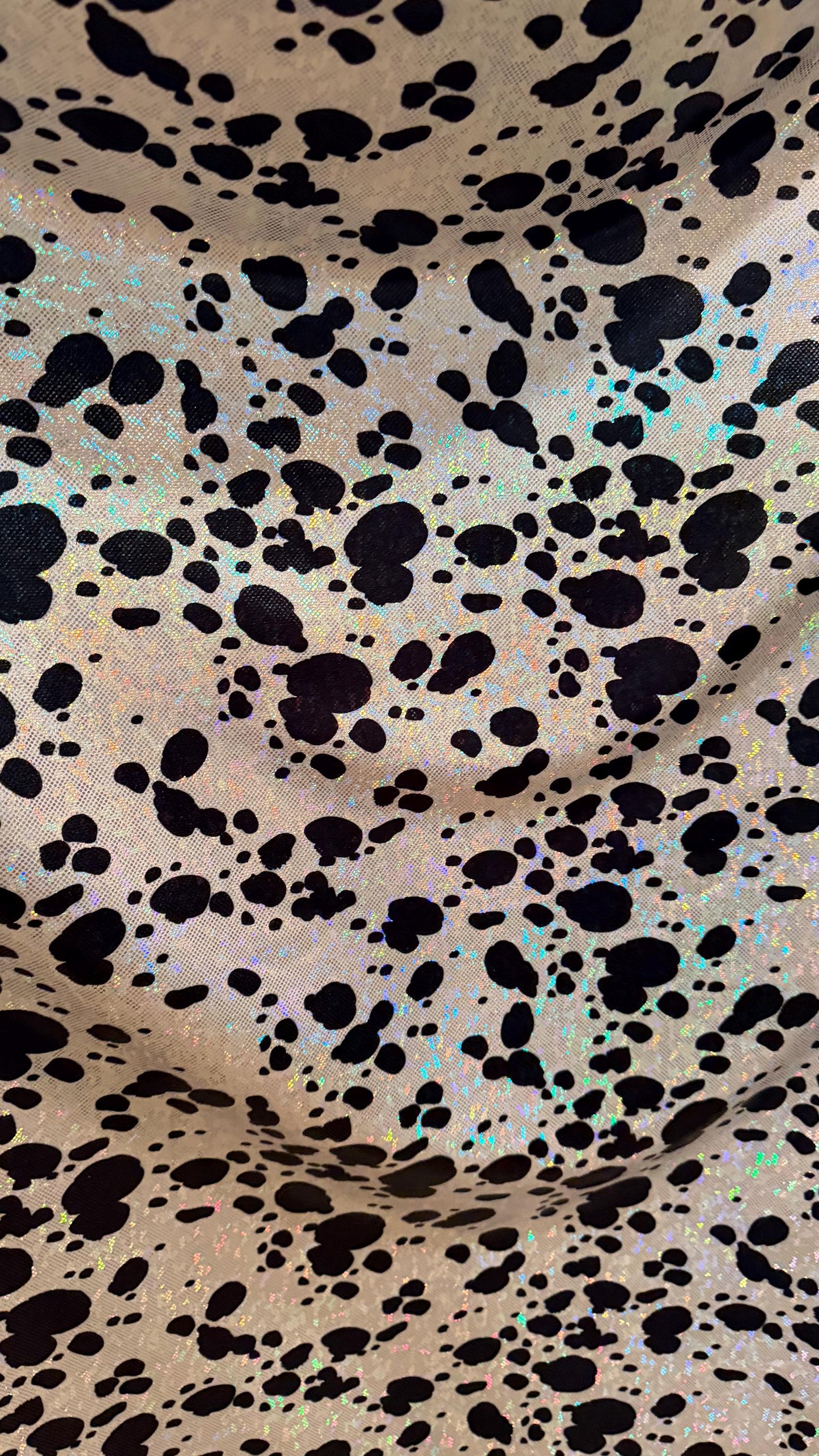 Dalmatian Exotic design w/silver/Black on shattered glass hologram metallic nylon spandex 4-way stretch 58/60” Sold by the YD. High quality