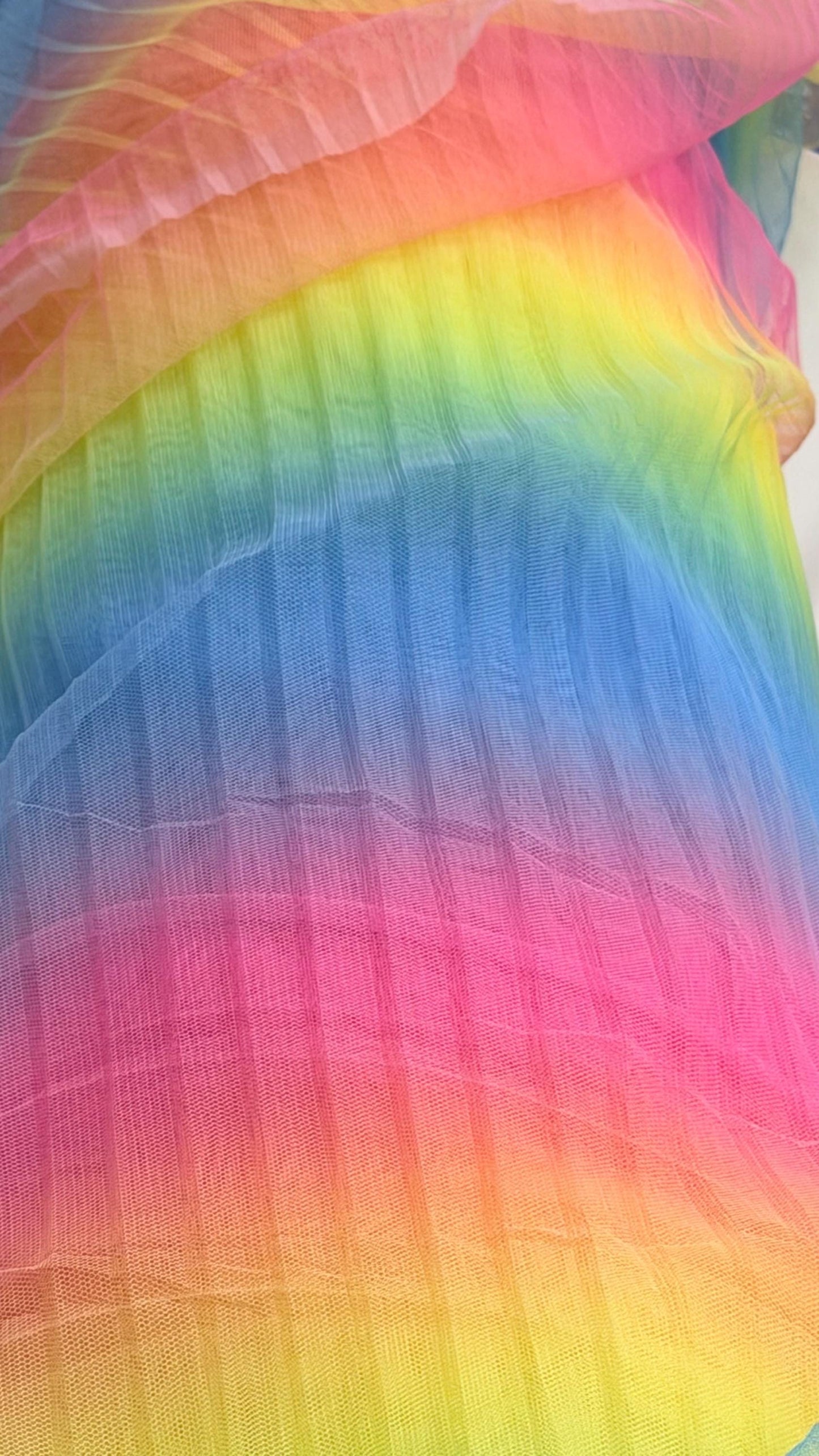 New Rainbow design print on pleated poly stretch mesh 2 way stretch 58/60" Sold by the YD. Ships worldwide from Los Angeles California USA.