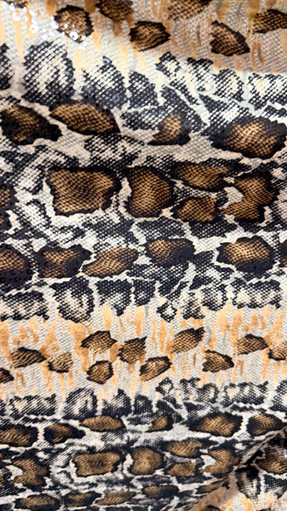 New Skin Snake design print on poly spandex with clear sequins  4-way stretch 58/60” Sold by the YD. Ships worldwide from Los Angeles CA