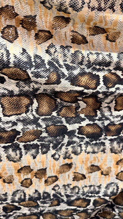 New Skin Snake design print on poly spandex with clear sequins  4-way stretch 58/60” Sold by the YD. Ships worldwide from Los Angeles CA