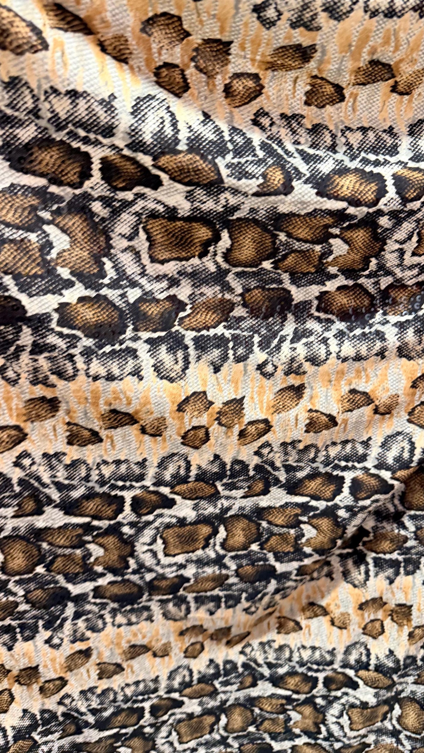 New Skin Snake design print on poly spandex with clear sequins  4-way stretch 58/60” Sold by the YD. Ships worldwide from Los Angeles CA
