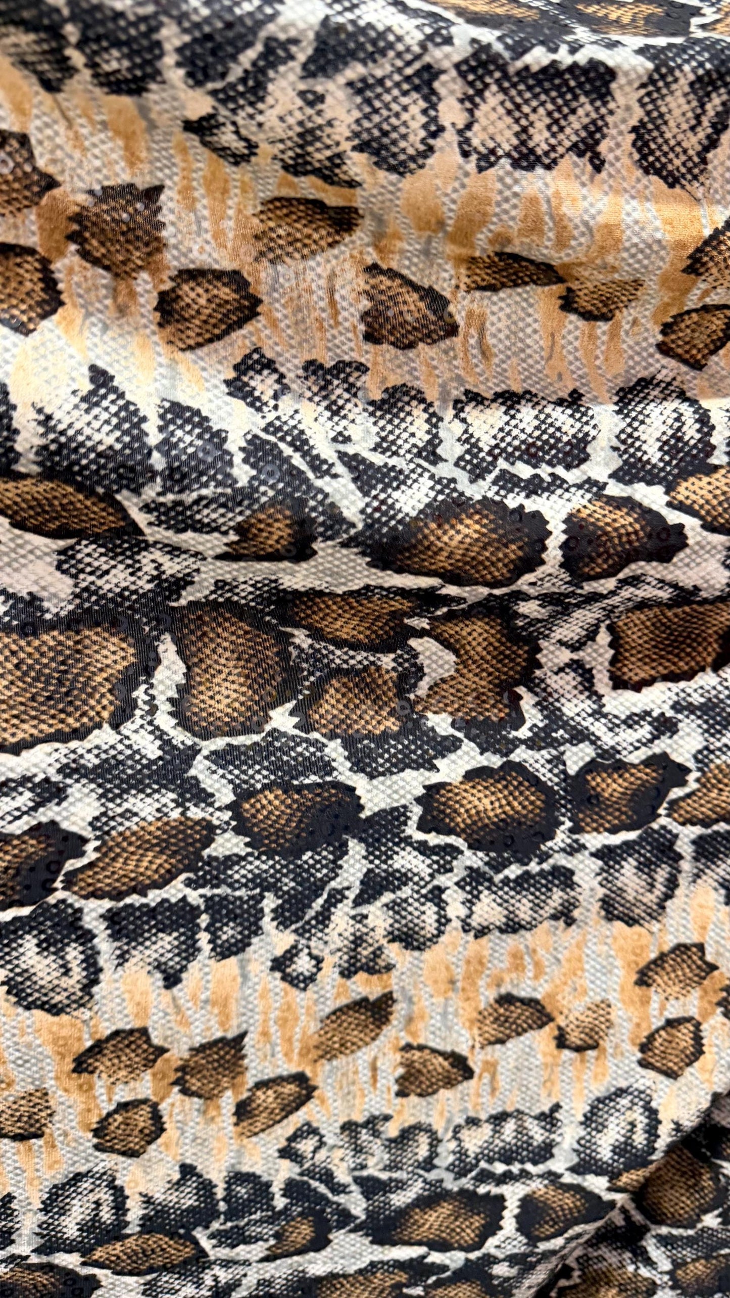 New Skin Snake design print on poly spandex with clear sequins  4-way stretch 58/60” Sold by the YD. Ships worldwide from Los Angeles CA