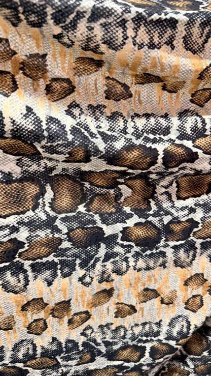 New Skin Snake design print on poly spandex with clear sequins  4-way stretch 58/60” Sold by the YD. Ships worldwide from Los Angeles CA