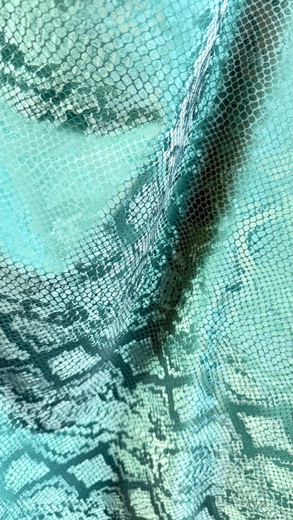 3D Exotic Python snake design forest green color  stretch PU vinyl 2-way stretch 58/60” Sold by the YD.