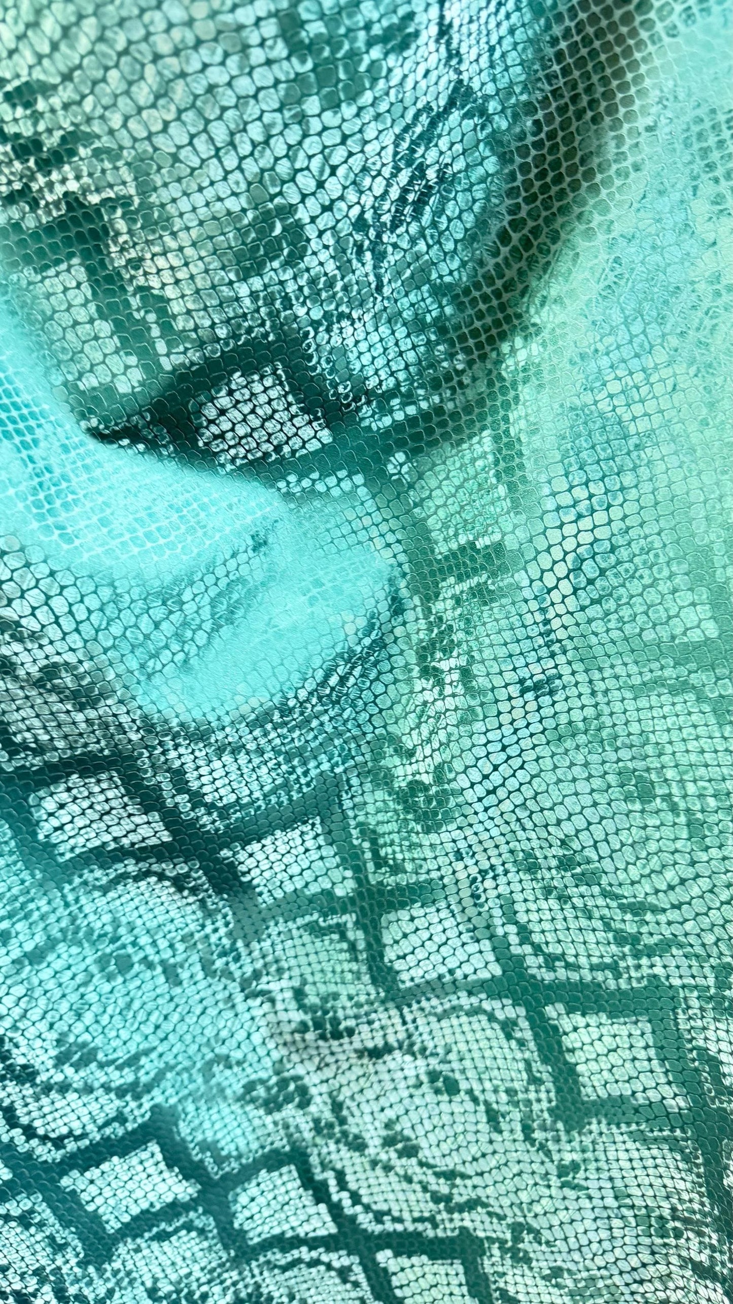 3D Exotic Python snake design forest green color  stretch PU vinyl 2-way stretch 58/60” Sold by the YD.