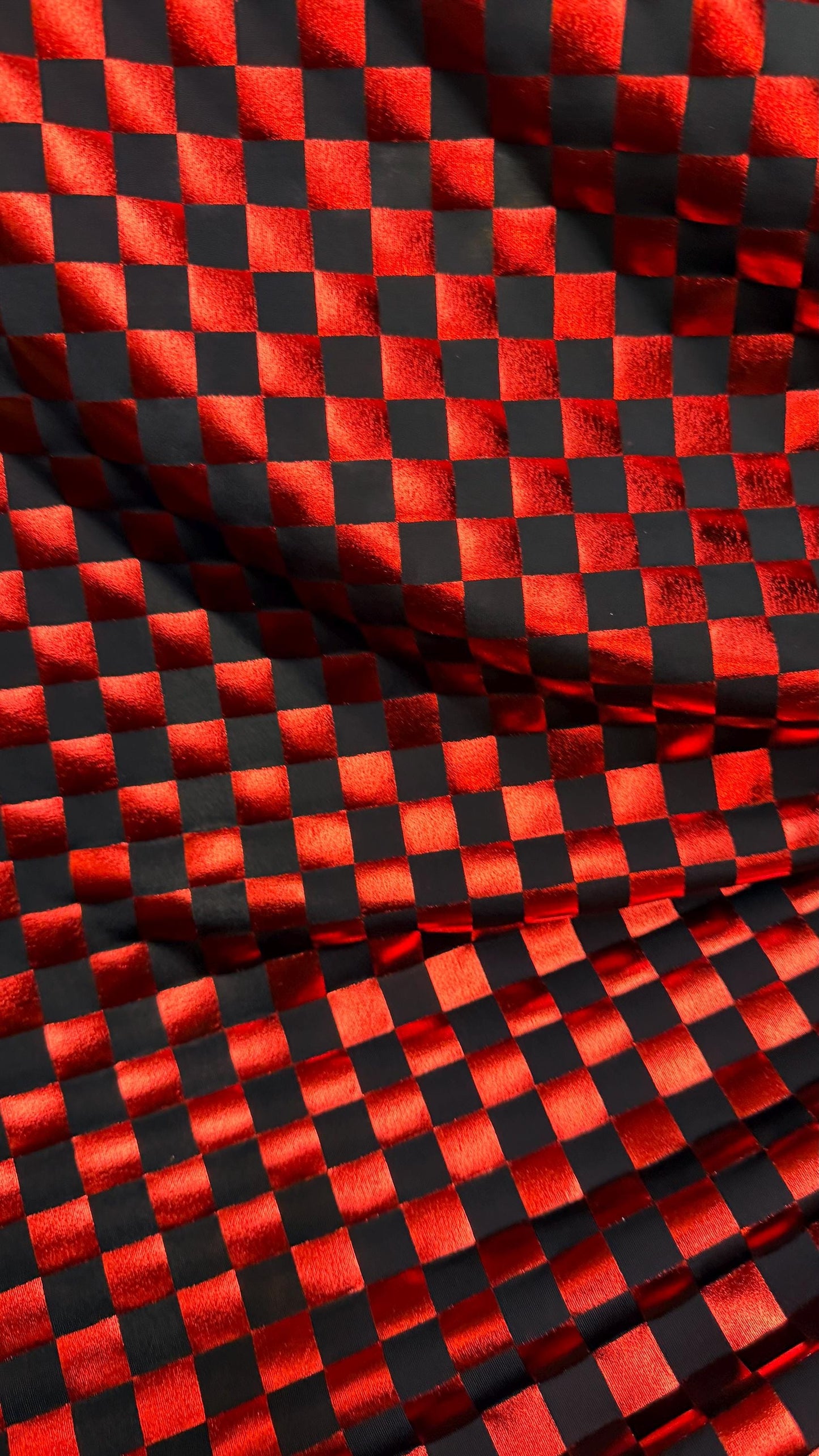 Checkered design metallic poly spandex Red/Black 2-way stretch 58/60” Sold by the YD. Ships Worldwide from Los Angeles California USA
