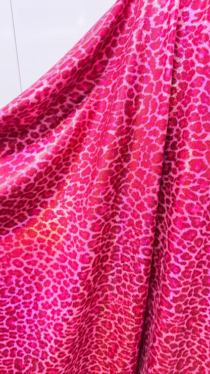 Wild Cheetah design Pink Color on hologram metallic foggy foil nylon spandex 4-way stretch 58/60” Sold by the YD.