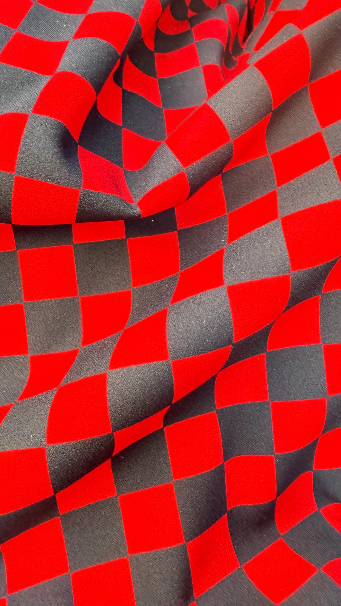 Checkered design 1" Red/Black  print on poly spandex 4way stretch 58/60" Sold by the YD. Ships worldwide from Los Angeles California USA