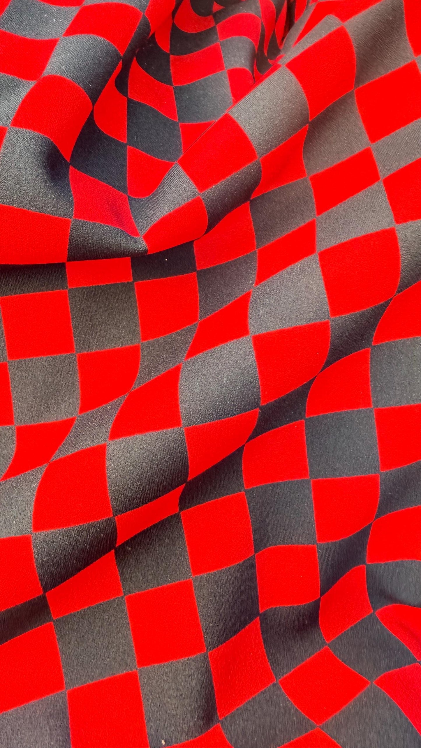 Checkered design 1" Red/Black  print on poly spandex 4way stretch 58/60" Sold by the YD. Ships worldwide from Los Angeles California USA