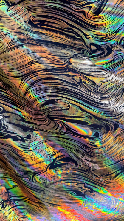 New Abstract design Iridescent metallic poly spandex 4way stretch 58/60" Sold by the YD. Ships worldwide from Los Angeles California USA.