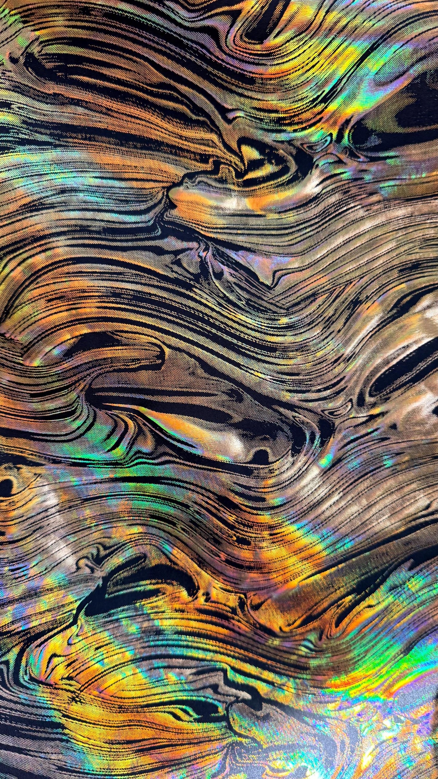 New Abstract design Iridescent metallic poly spandex 4way stretch 58/60" Sold by the YD. Ships worldwide from Los Angeles California USA.