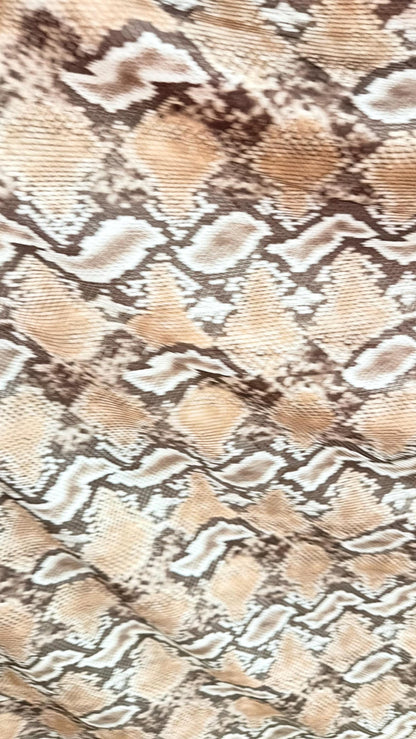 New Mamba Exotic snake design Taupe/black print on best quality of nylon spandex 4-way stretch 58/60” Sold by the YD. Ships worldwide