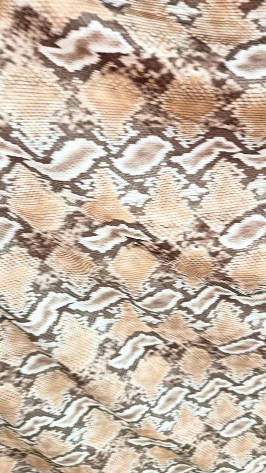 New Mamba Exotic snake design Taupe/black print on best quality of nylon spandex 4-way stretch 58/60” Sold by the YD. Ships worldwide