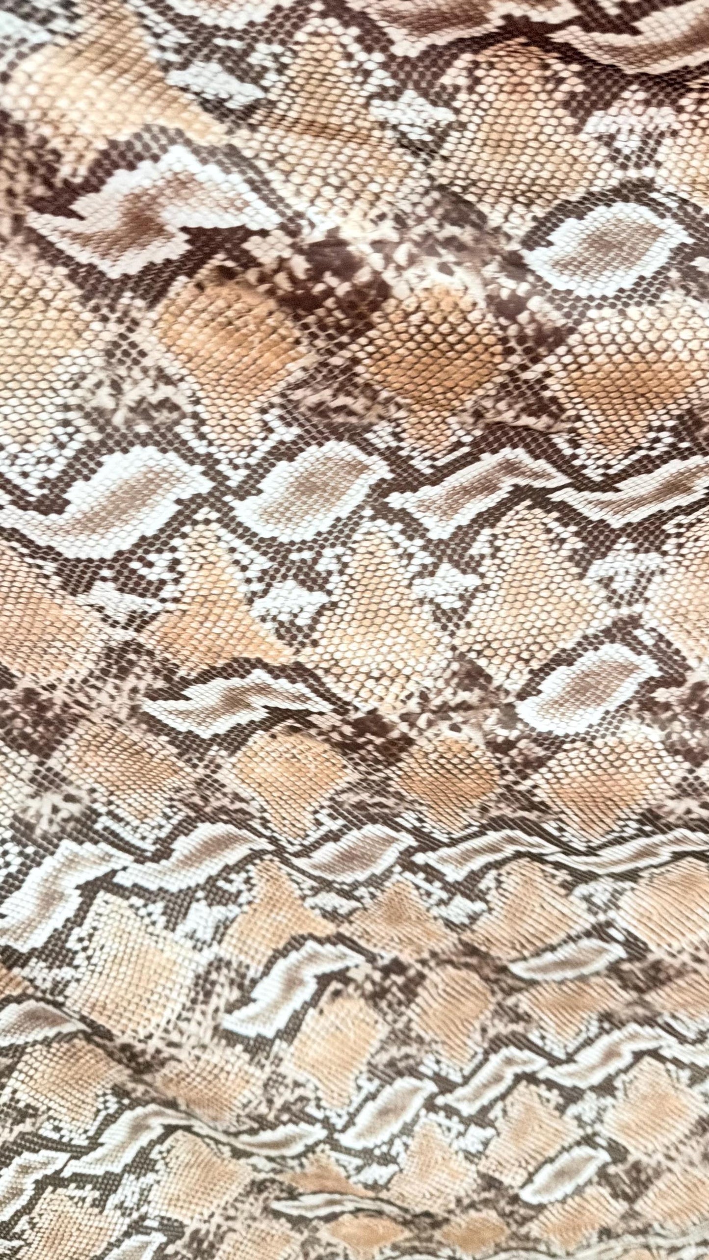 New Mamba Exotic snake design Taupe/black print on best quality of nylon spandex 4-way stretch 58/60” Sold by the YD. Ships worldwide