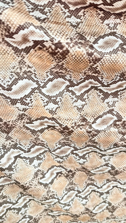 New Mamba Exotic snake design Taupe/black print on best quality of nylon spandex 4-way stretch 58/60” Sold by the YD. Ships worldwide