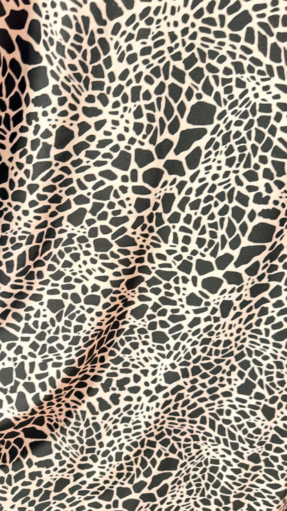 New Giraffe Abstrat design print on nylon spandex 4-way stretch 58/60” Sold by the YD. Ships worldwide from Los Angeles California USA.