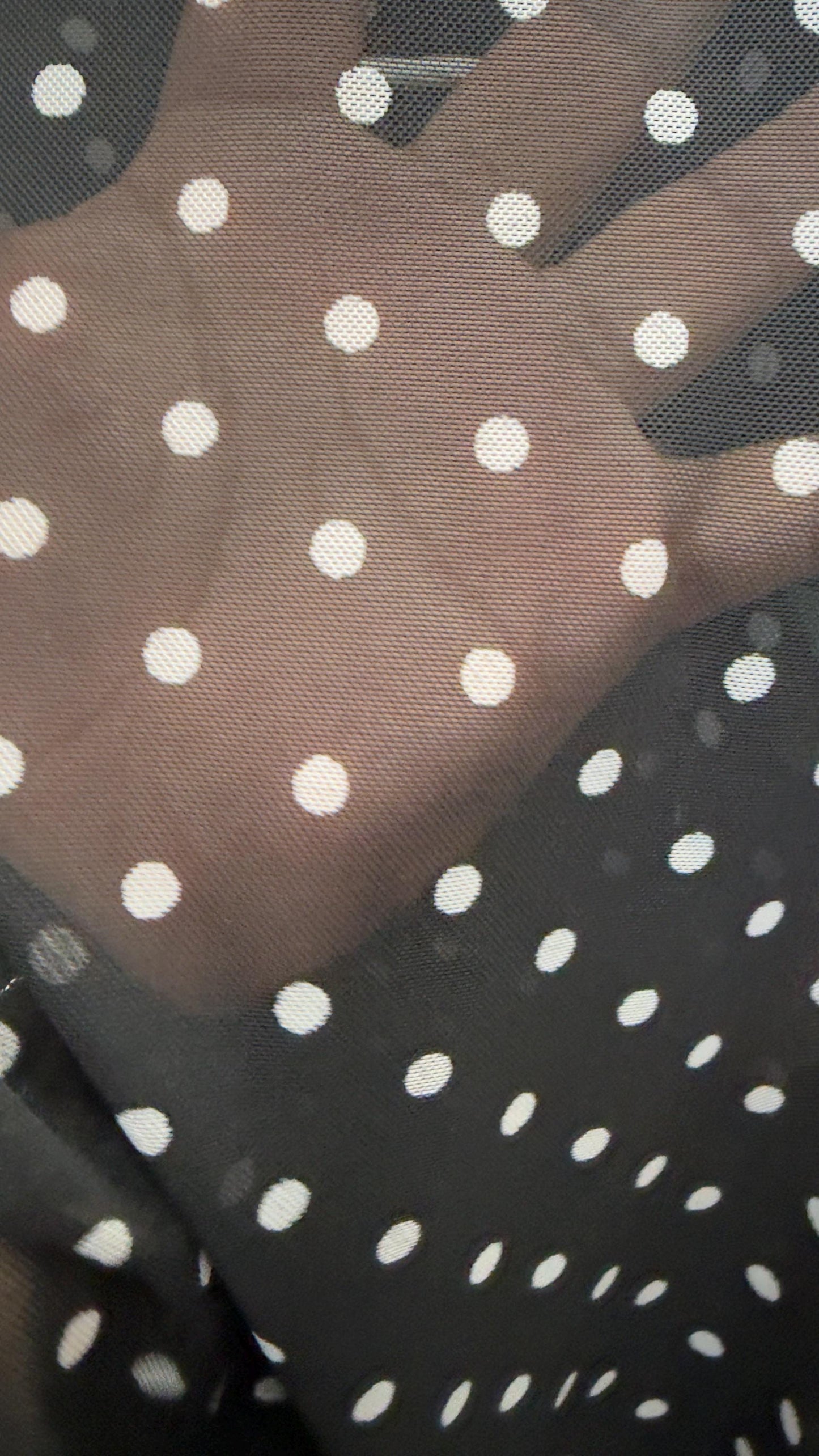 New polka dots design print on power mesh 4-way stretch Black/white 58/60” Sold by the YD. Ships worldwide from Los Angeles California USA.