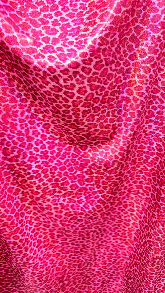 Wild Cheetah design Pink Color on hologram metallic foggy foil nylon spandex 4-way stretch 58/60” Sold by the YD.