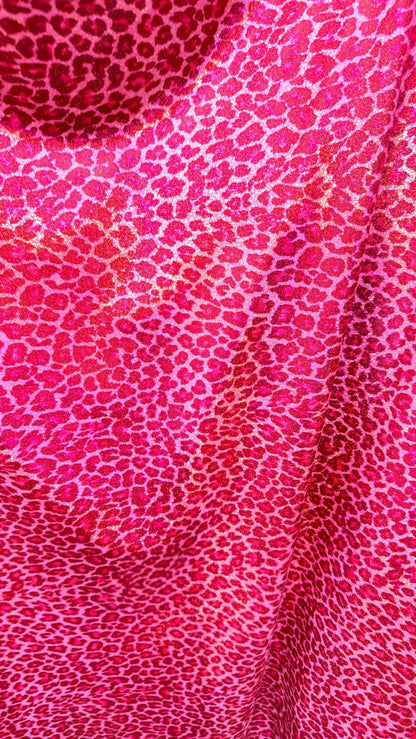 Wild Cheetah design Pink Color on hologram metallic foggy foil nylon spandex 4-way stretch 58/60” Sold by the YD.