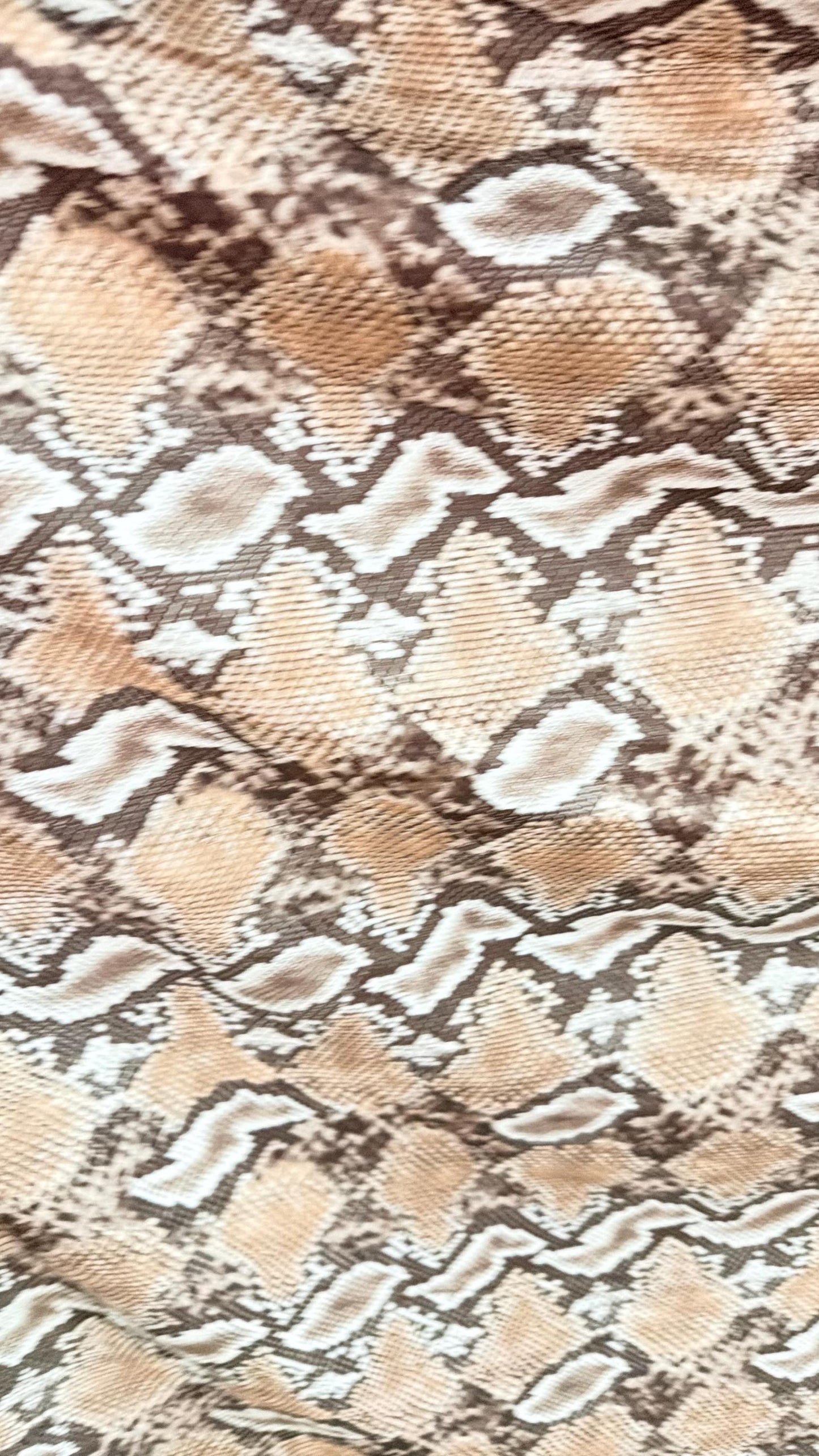 New Mamba Exotic snake design Taupe/black print on best quality of nylon spandex 4-way stretch 58/60” Sold by the YD. Ships worldwide