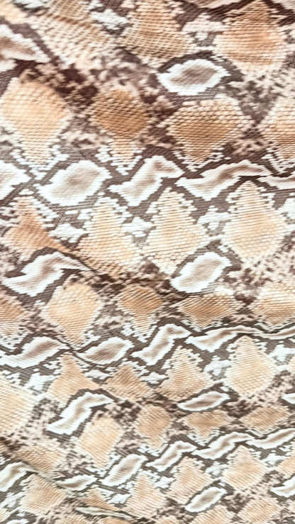 New Mamba Exotic snake design Taupe/black print on best quality of nylon spandex 4-way stretch 58/60” Sold by the YD. Ships worldwide
