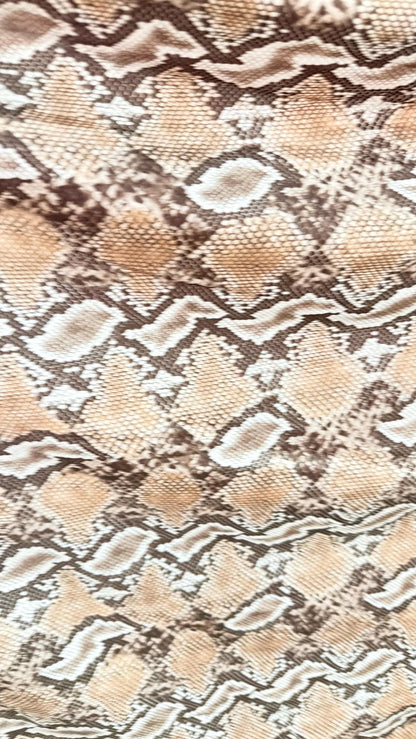 New Mamba Exotic snake design Taupe/black print on best quality of nylon spandex 4-way stretch 58/60” Sold by the YD. Ships worldwide