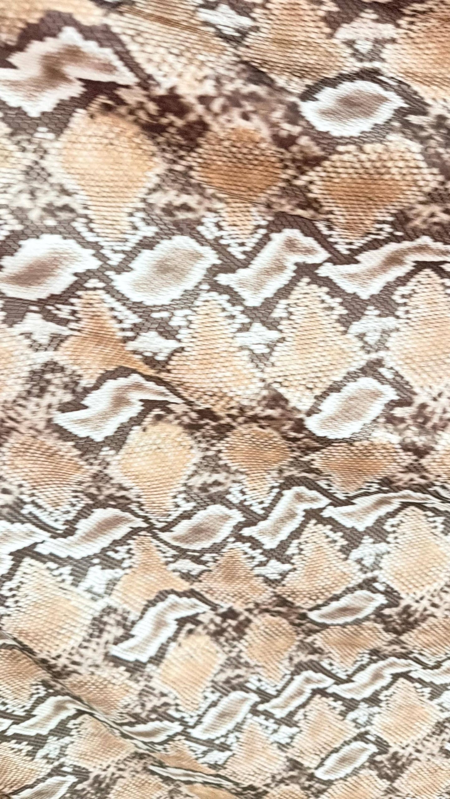 New Mamba Exotic snake design Taupe/black print on best quality of nylon spandex 4-way stretch 58/60” Sold by the YD. Ships worldwide