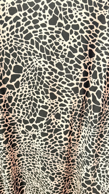 New Giraffe Abstrat design print on nylon spandex 4-way stretch 58/60” Sold by the YD. Ships worldwide from Los Angeles California USA.