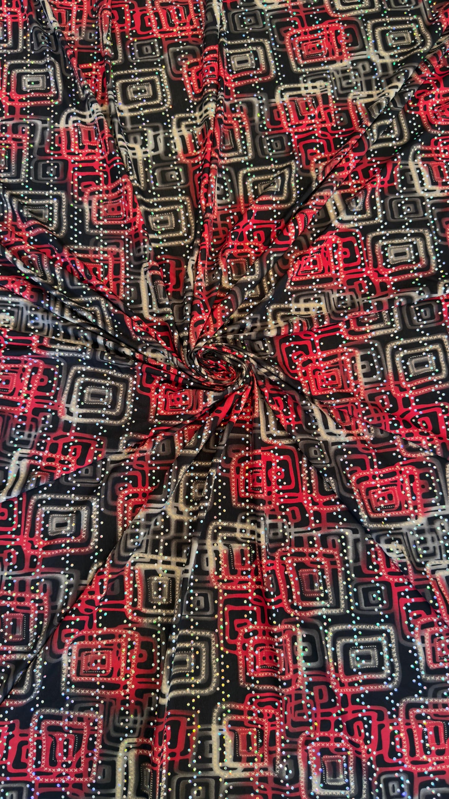 New modern geometric design poly spandex with holo sequins medium weight 2-way stretch 58/60” Sold by the YD. Ships worldwide