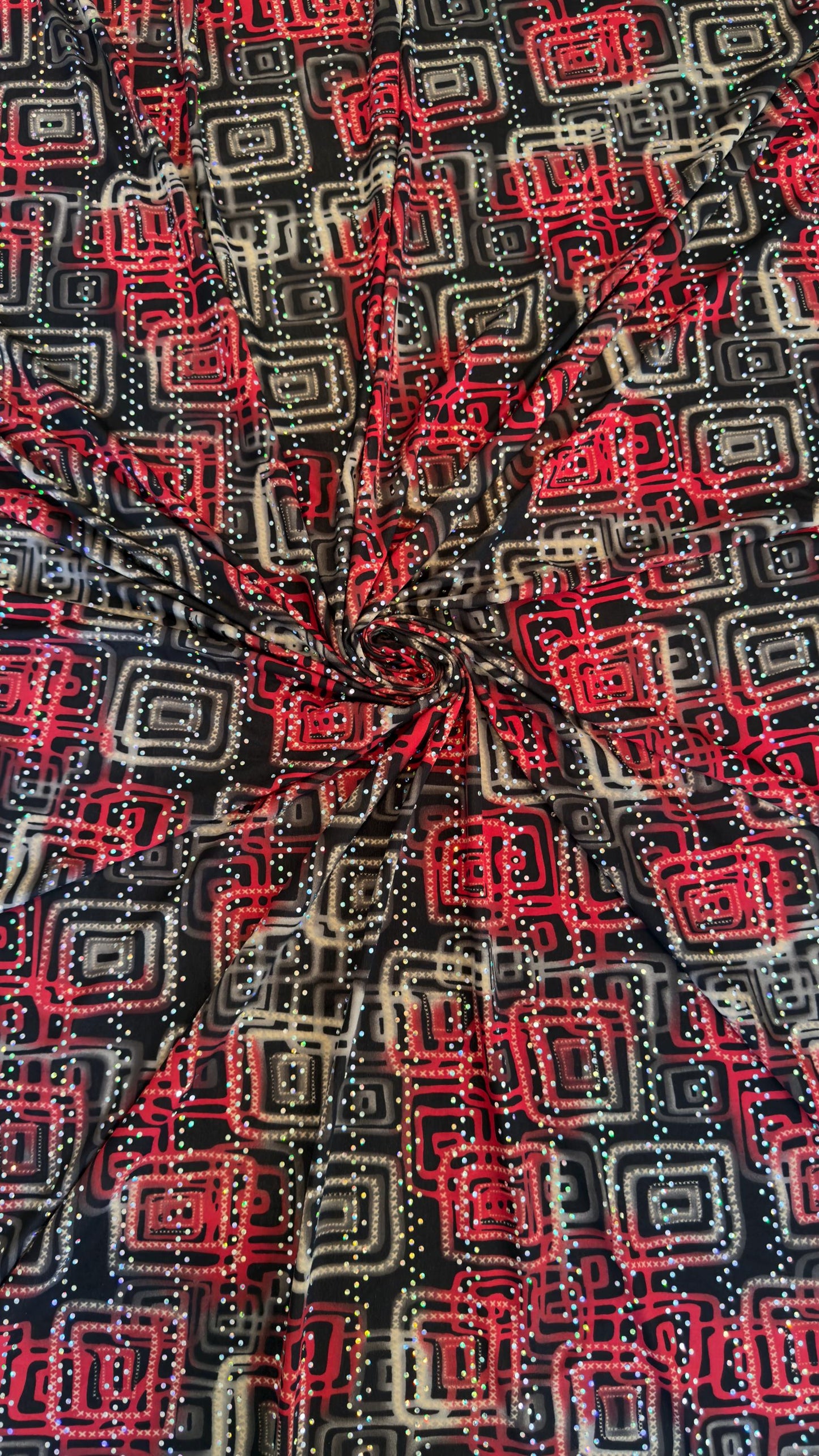 New modern geometric design poly spandex with holo sequins medium weight 2-way stretch 58/60” Sold by the YD. Ships worldwide