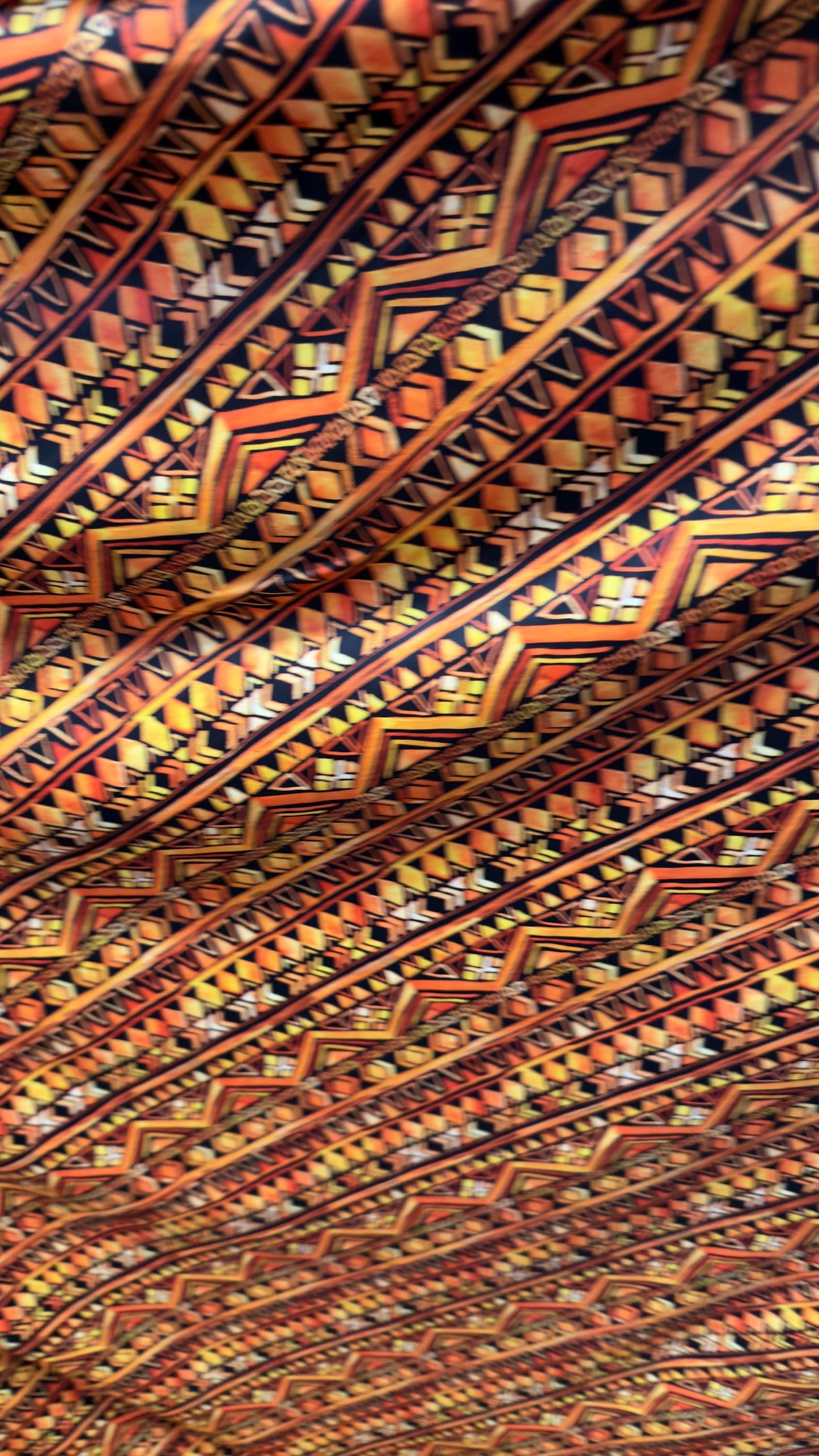AZTEC design Yellow/Orange on nylon spandex 4way Stretch 58/60" Sold by the yd Ships worldwide from Los Angeles California USA.