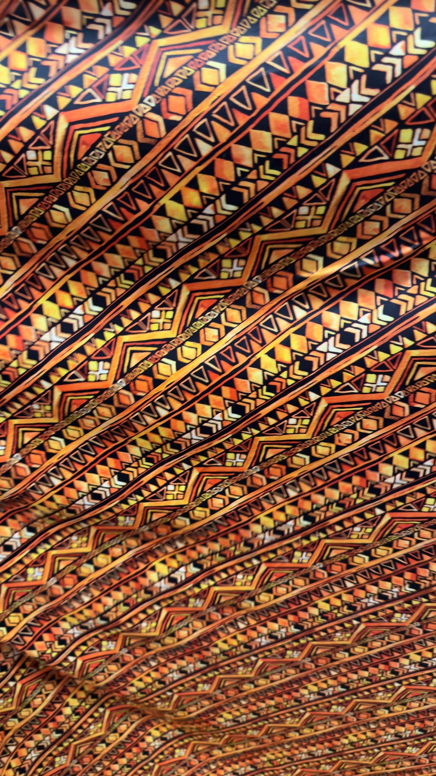 AZTEC design Yellow/Orange on nylon spandex 4way Stretch 58/60" Sold by the yd Ships worldwide from Los Angeles California USA.