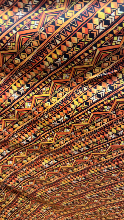 AZTEC design Yellow/Orange on nylon spandex 4way Stretch 58/60" Sold by the yd Ships worldwide from Los Angeles California USA.