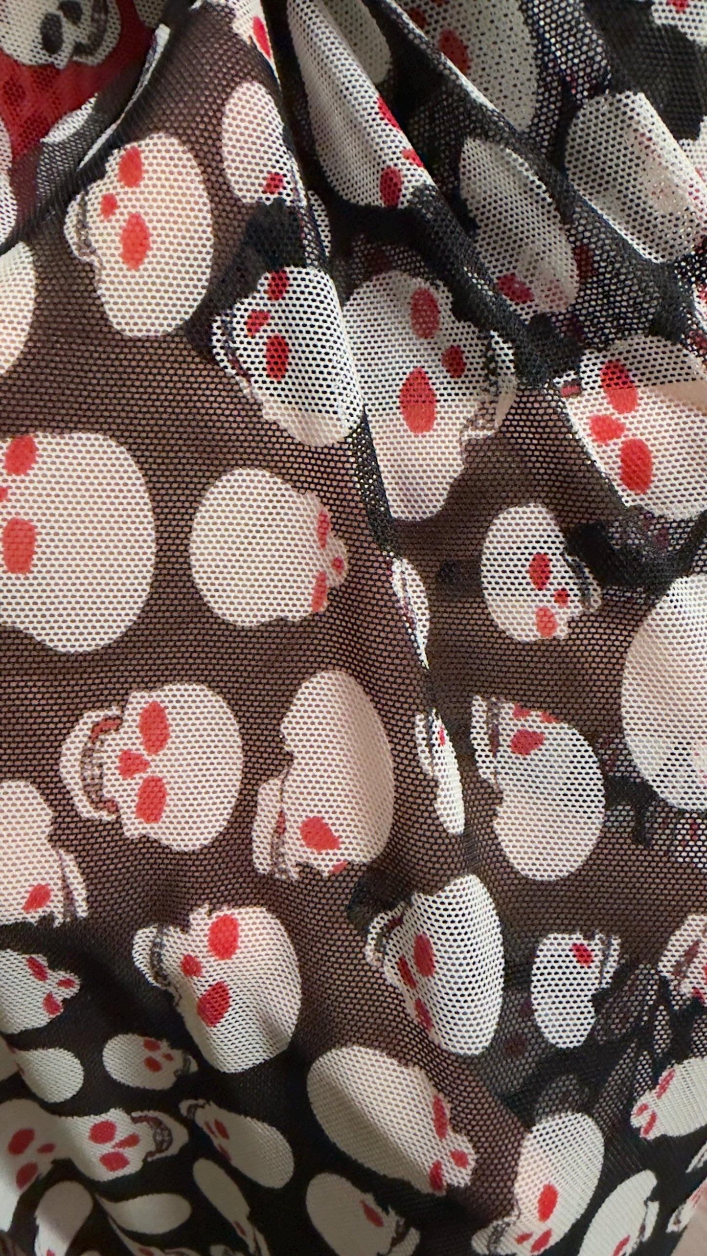 New Terminator skull desin on power mesh nylon spandex 4 way stretch 58/60" Sold by the YD. Ships worldwide from Los Angeles California USA.