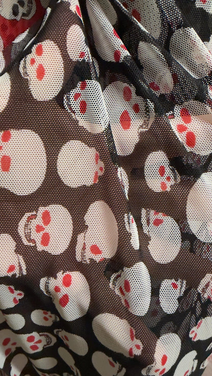 New Terminator skull desin on power mesh nylon spandex 4 way stretch 58/60" Sold by the YD. Ships worldwide from Los Angeles California USA.