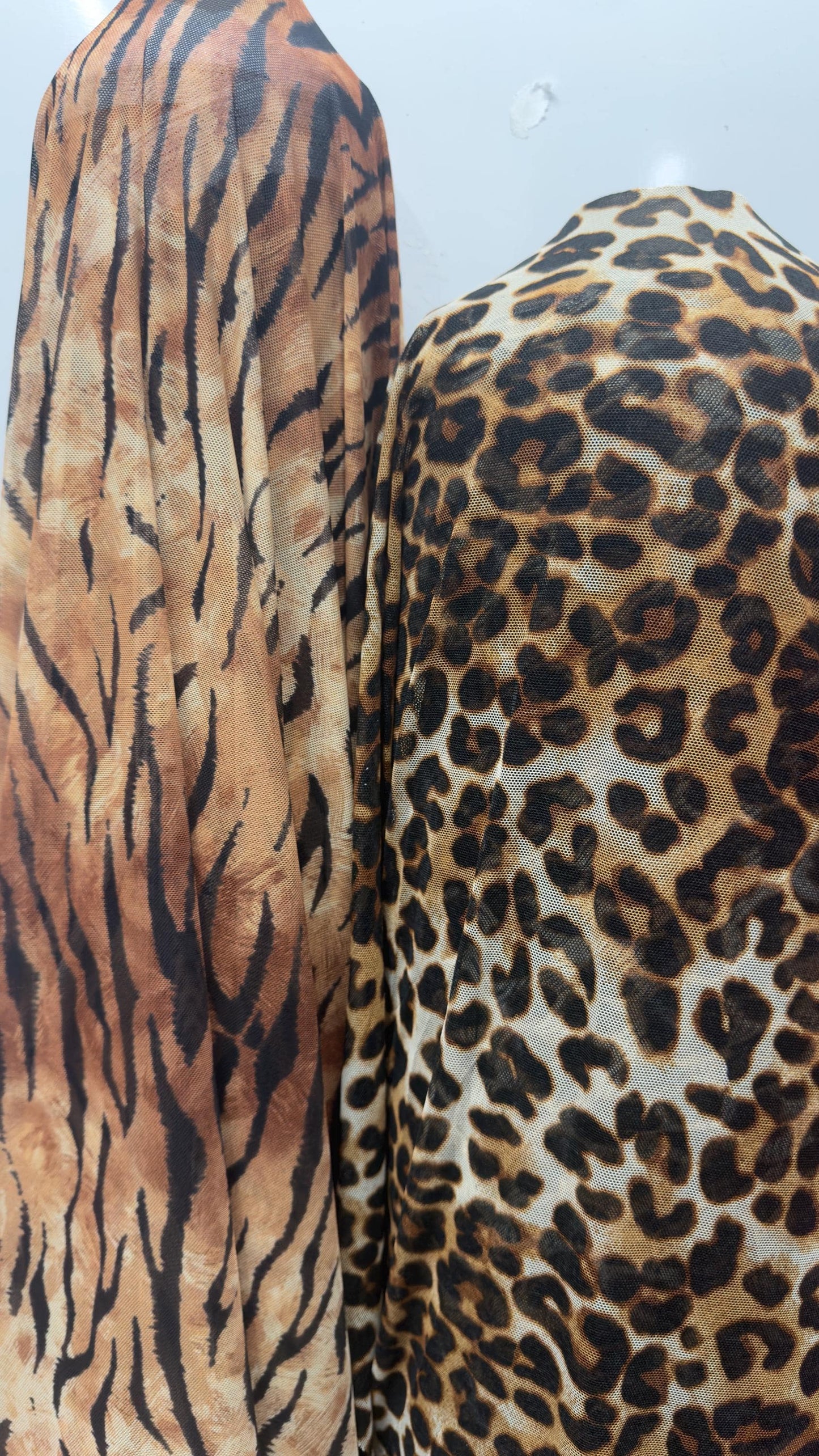 Exotic Tiger and Leopard design print on great quality of power mesh 4-way stretch 58/60” Sold by the YD. Ships Worldwide from Los Angeles