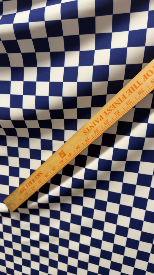 Sapphire/White Checkered design 1" print on nylon spandex 4way stretch 58/60" Sold by the YD. Ships worldwide from Los Angeles California