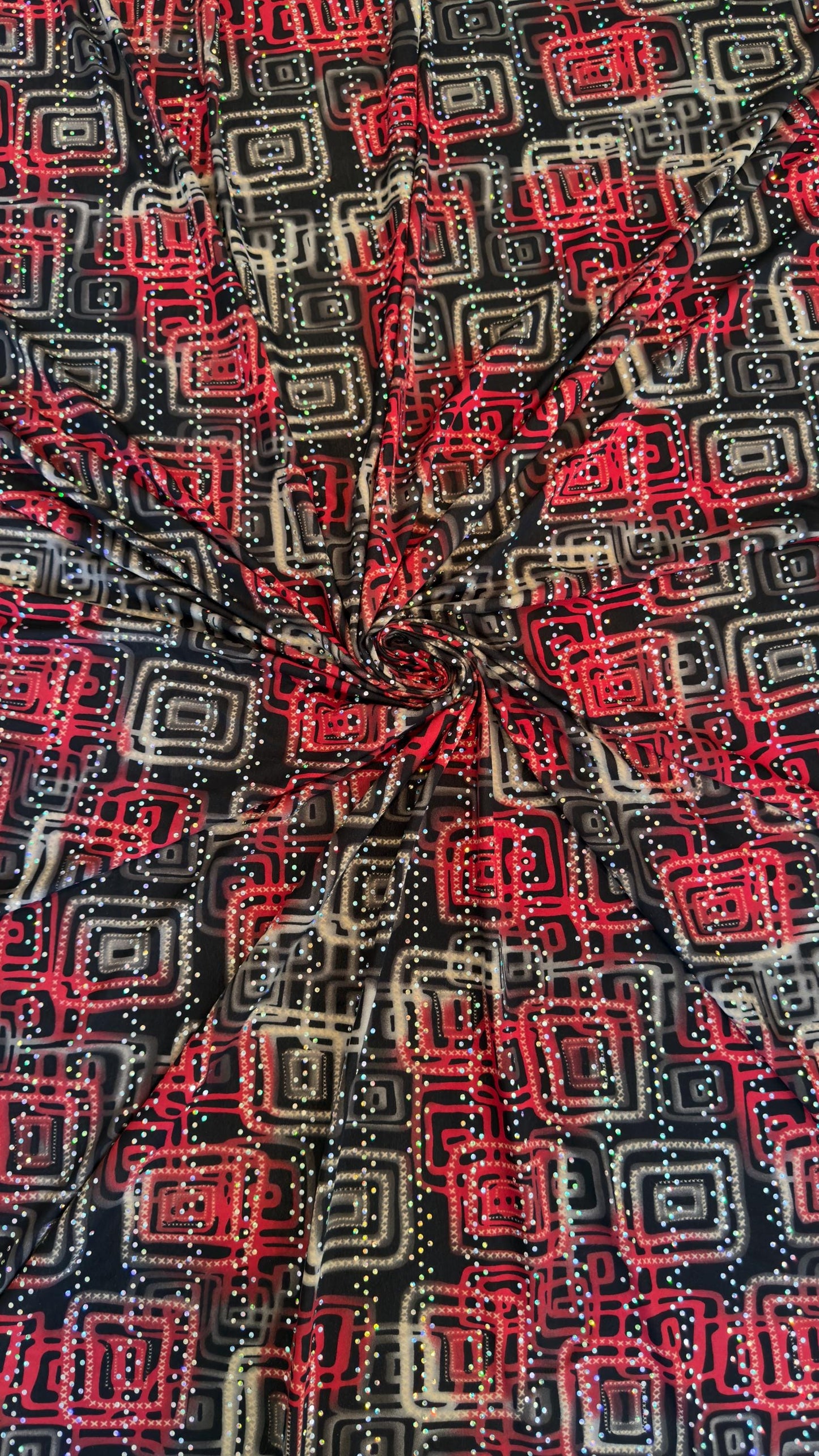 New modern geometric design poly spandex with holo sequins medium weight 2-way stretch 58/60” Sold by the YD. Ships worldwide