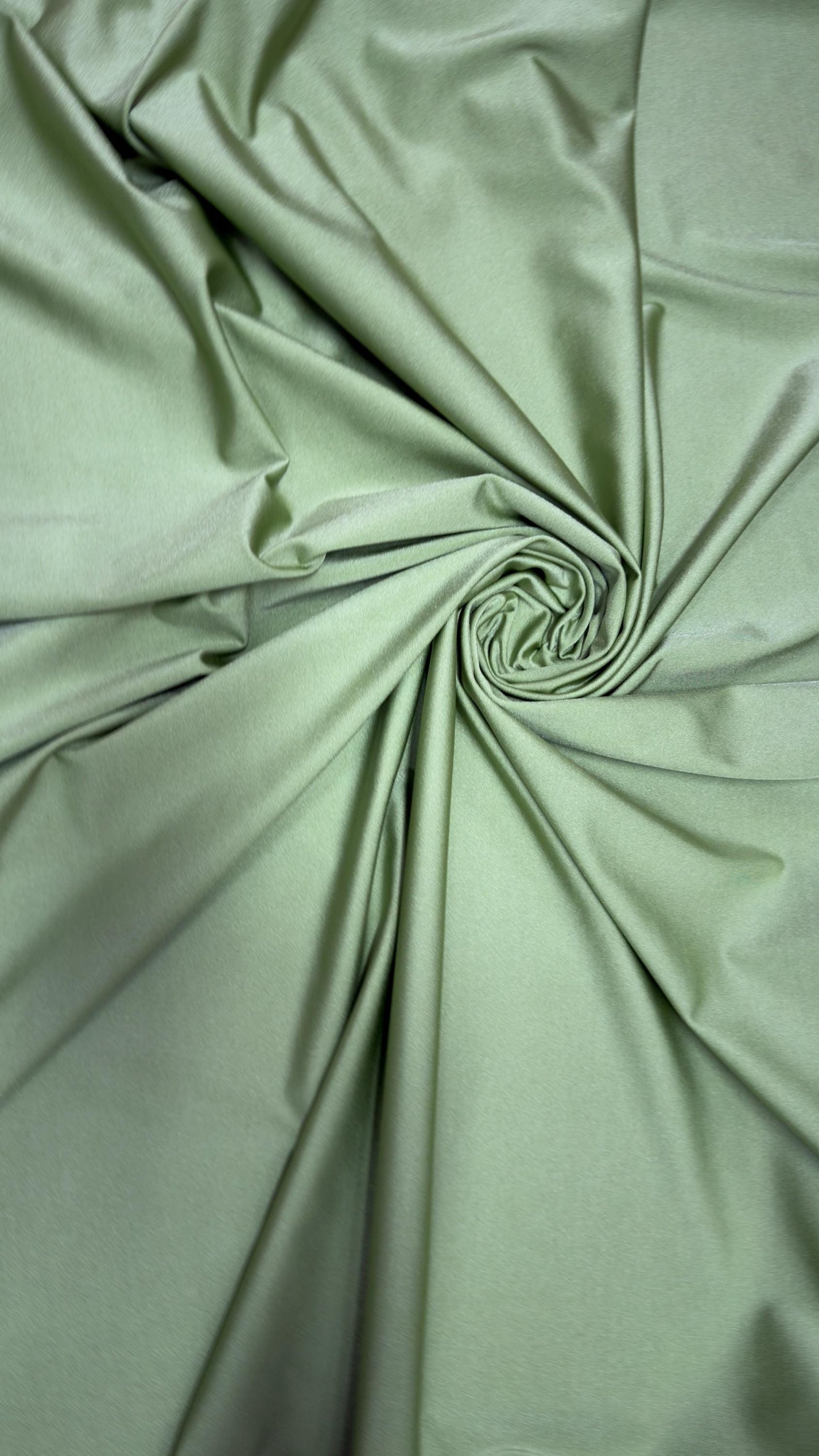 Great quality shiny Kiwi nylon spandex 4-way stretch 58/60” Sold by the YD. Ships worldwide from Los Ángeles California USA.
