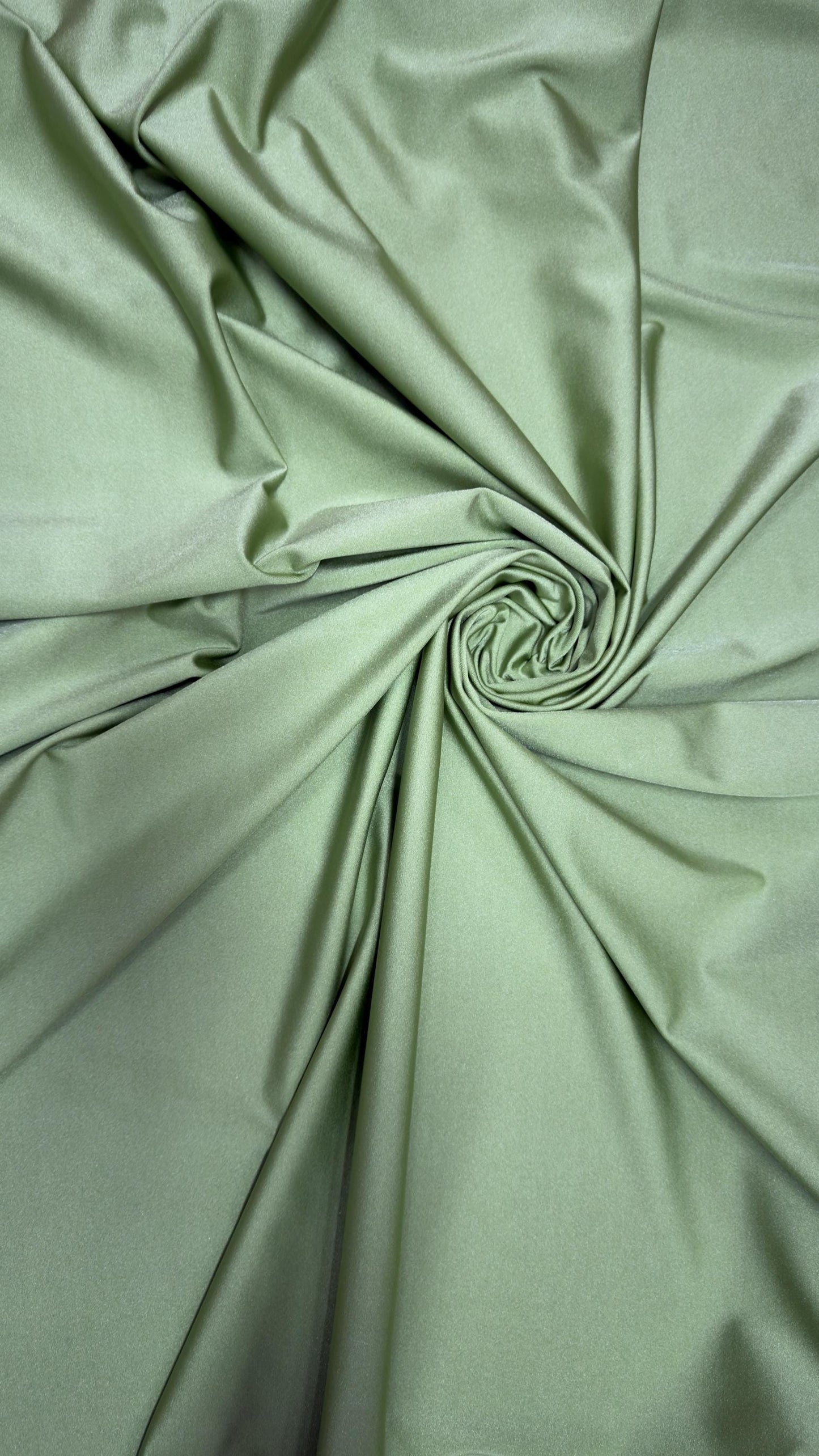 Great quality shiny Kiwi nylon spandex 4-way stretch 58/60” Sold by the YD. Ships worldwide from Los Ángeles California USA.
