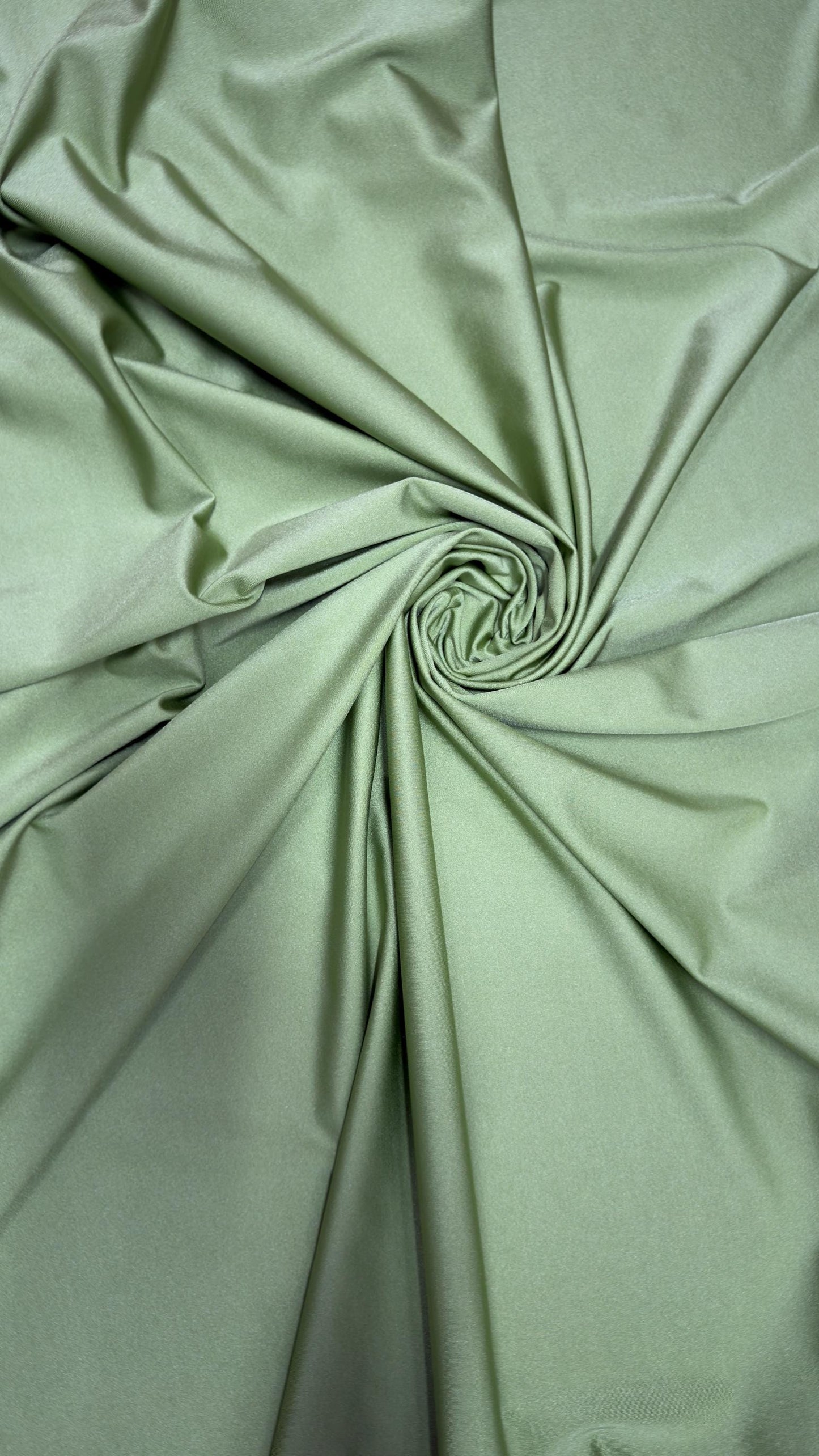 Great quality shiny Kiwi nylon spandex 4-way stretch 58/60” Sold by the YD. Ships worldwide from Los Ángeles California USA.