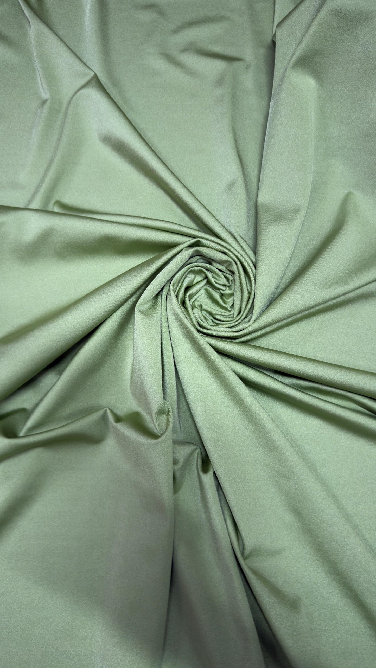 Great quality shiny Kiwi nylon spandex 4-way stretch 58/60” Sold by the YD. Ships worldwide from Los Ángeles California USA.