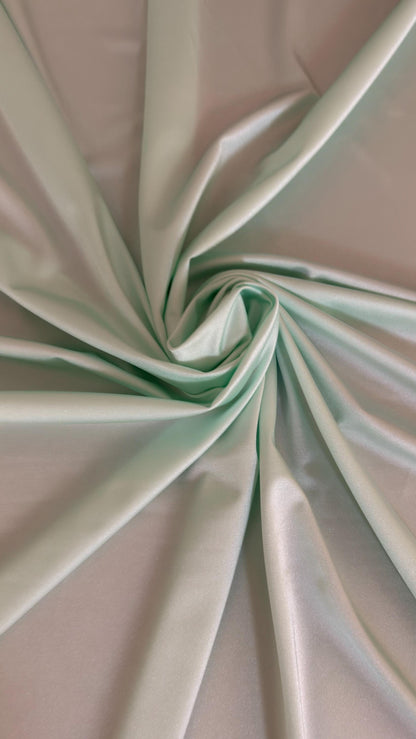 Great quality shiny Soft Mint color nylon spandex 4-way stretch 58/60” Sold by the YD. Ships worldwide from Los Ángeles California USA.