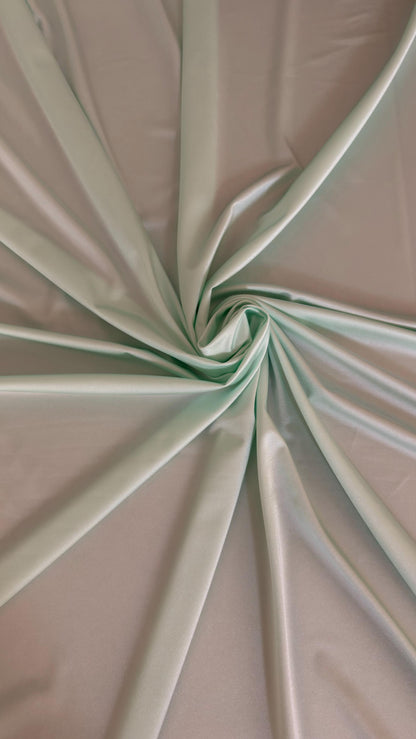 Great quality shiny Soft Mint color nylon spandex 4-way stretch 58/60” Sold by the YD. Ships worldwide from Los Ángeles California USA.