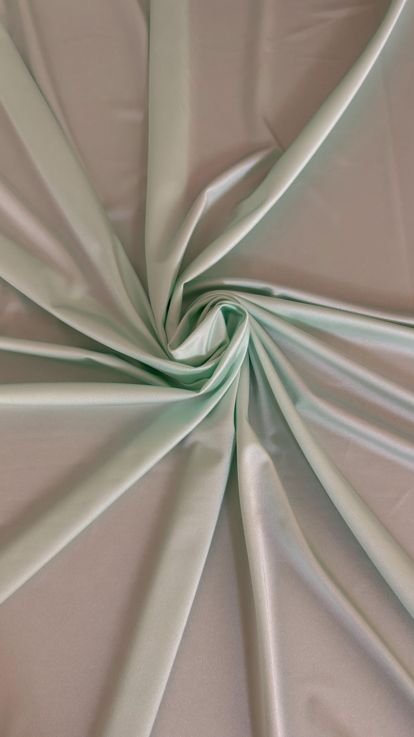 Great quality shiny Soft Mint color nylon spandex 4-way stretch 58/60” Sold by the YD. Ships worldwide from Los Ángeles California USA.