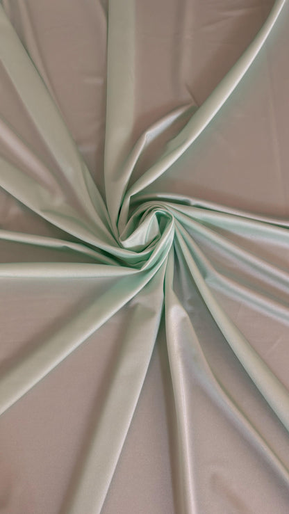Great quality shiny Soft Mint color nylon spandex 4-way stretch 58/60” Sold by the YD. Ships worldwide from Los Ángeles California USA.