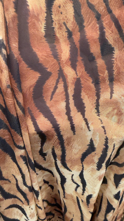 Exotic Tiger and Leopard design print on great quality of power mesh 4-way stretch 58/60” Sold by the YD. Ships Worldwide from Los Angeles